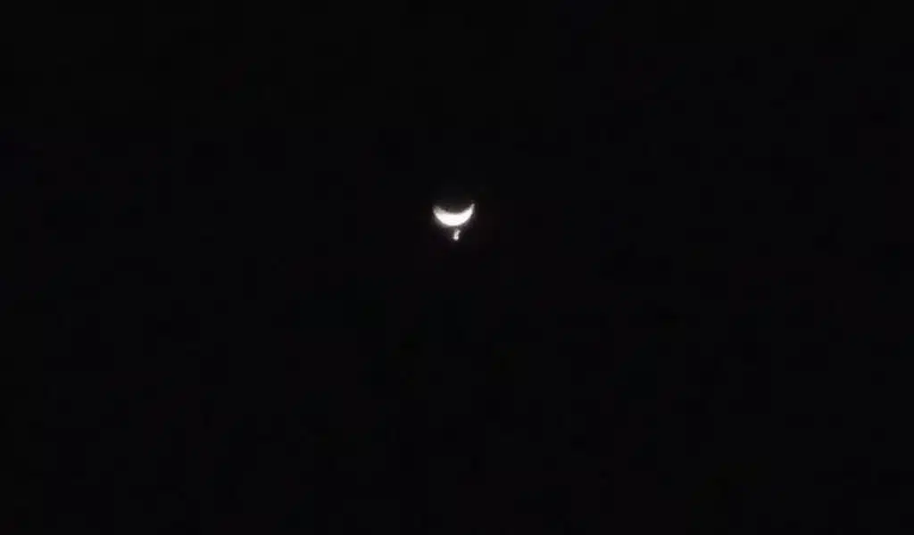 Venus disappears behind the Moon