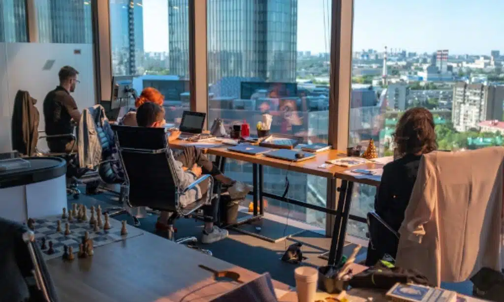 Employees utilizing advanced technology and analytical tools to enhance and streamline sales operations.