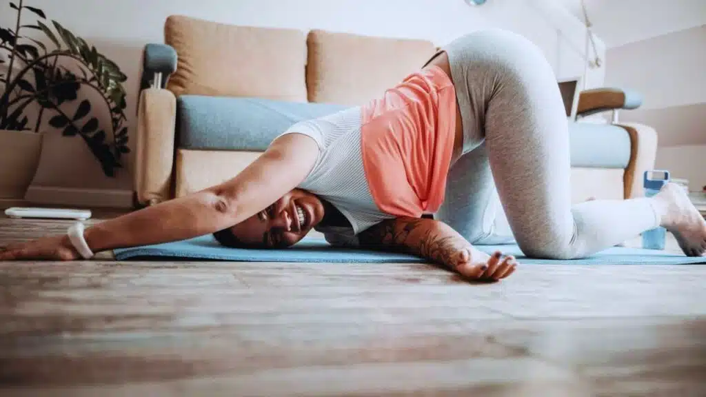 Beaming smiling woman spending time in strange posture