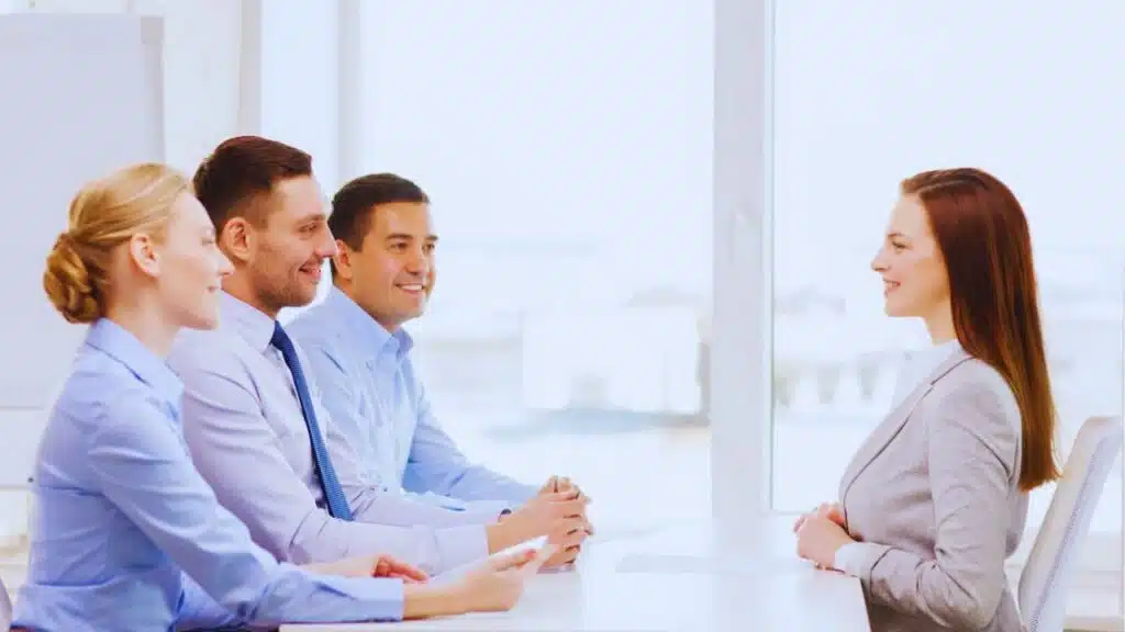 smiling businesswoman at interview in office