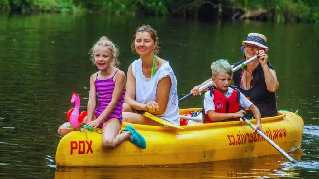 Canoeing family with three-generation Czech women, Paddlers going down by Otava river People Vacations in summer