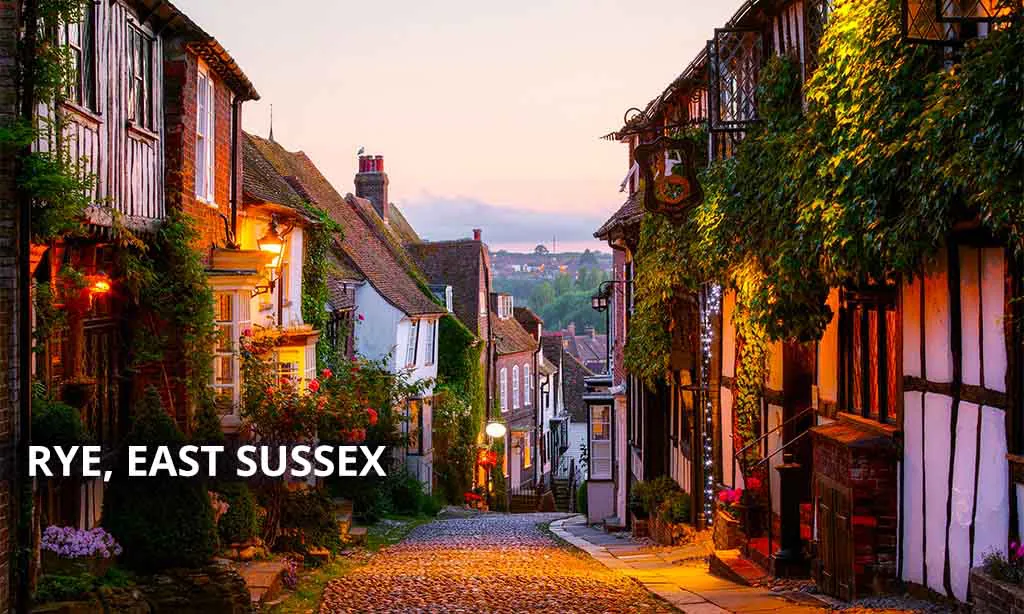 Dusk at a row of beautiful old houses on a cobbled street in Rye, East sussex
