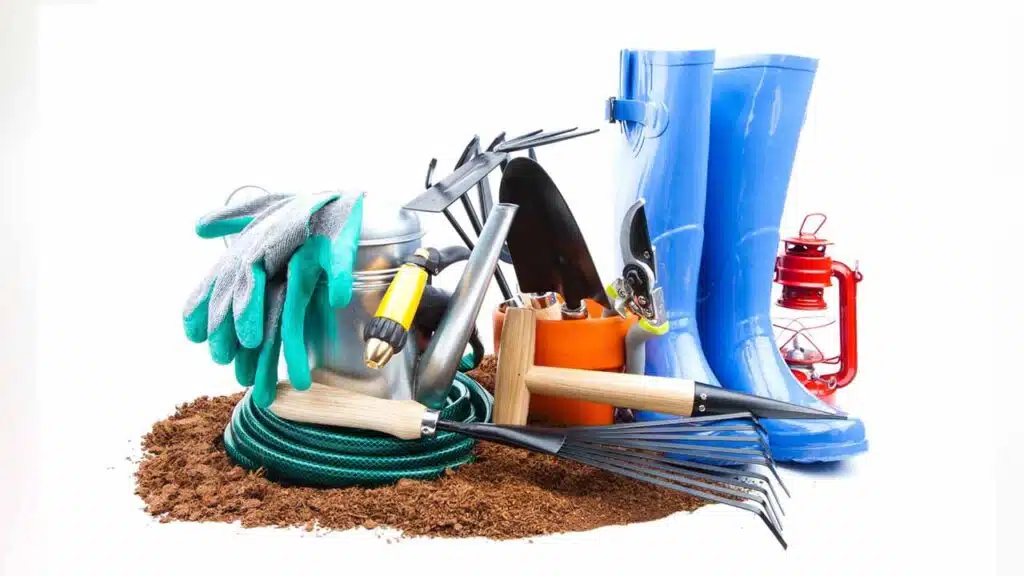 Gardening tools and equipment on soil