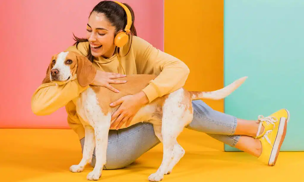 Happy woman hugging her dog