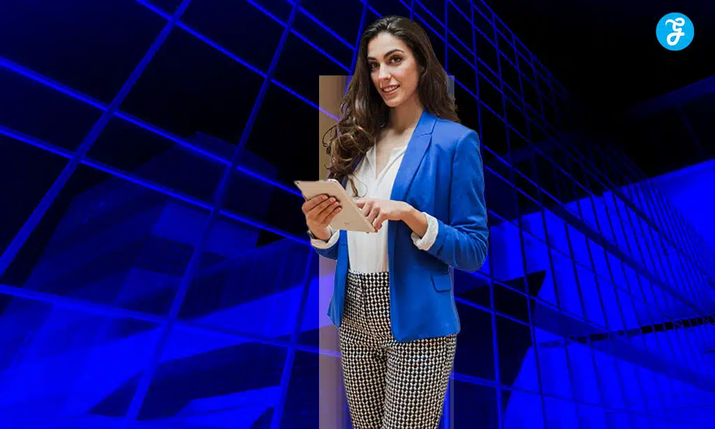 Businesswoman in a blue suit using a tablet, with a modern digital background.