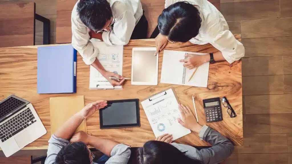 Team collaborating on a project with documents