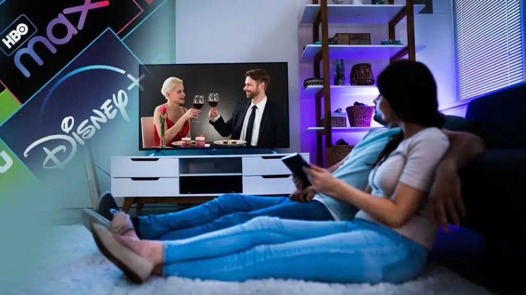 Couple watching streaming services on TV at home.