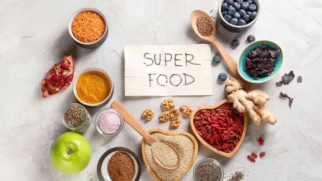 Superfoods assortment with berries, seeds, and spices.