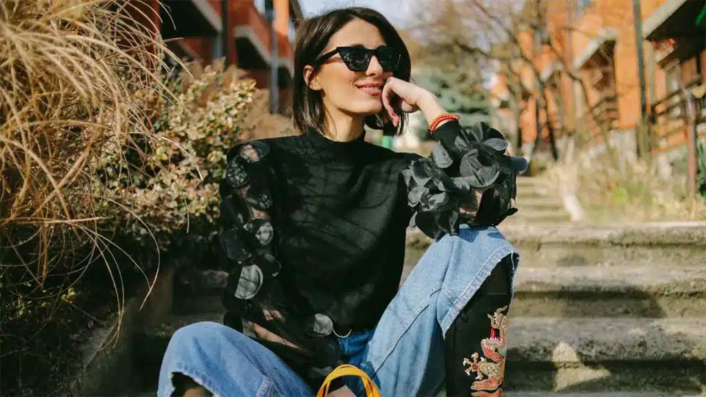Woman enjoying a sunny day outdoors.