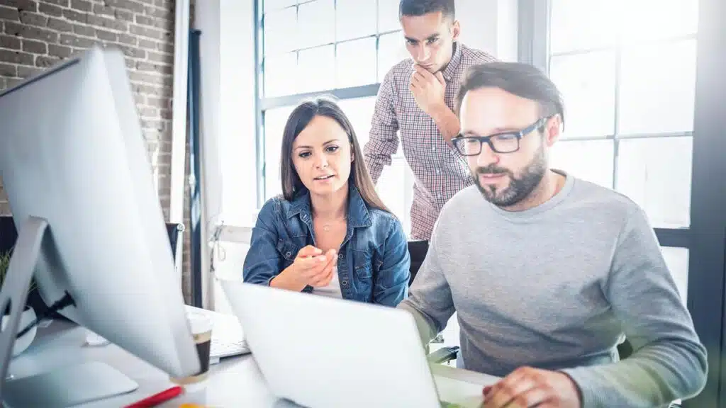 Team collaborating on a project at the office.