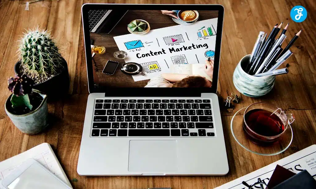 Laptop on a desk with a "Content Marketing" screen