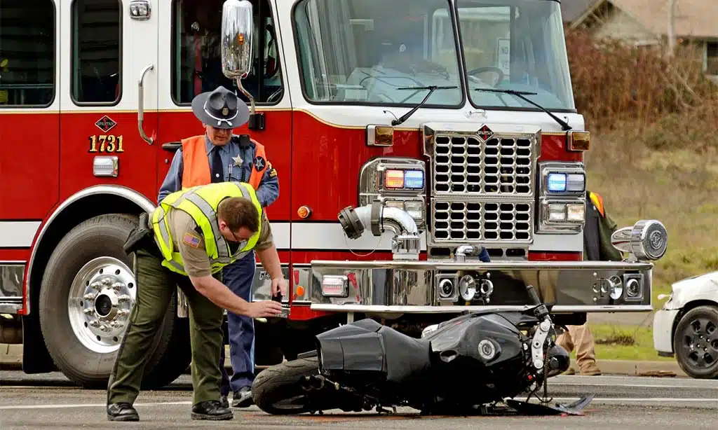 Emergency responders at the scene of a motorcycle accident.