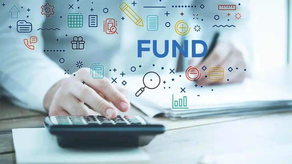 Businessperson calculating financial data with a calculator