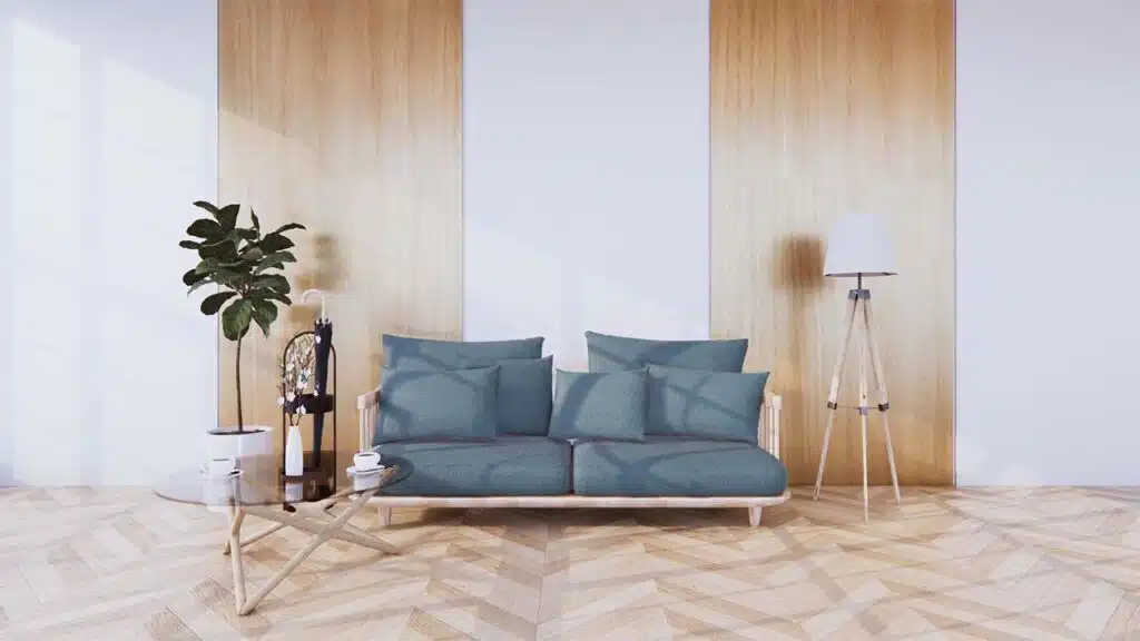 Modern living room interior with a minimalist design featuring a light wood sofa with teal cushions