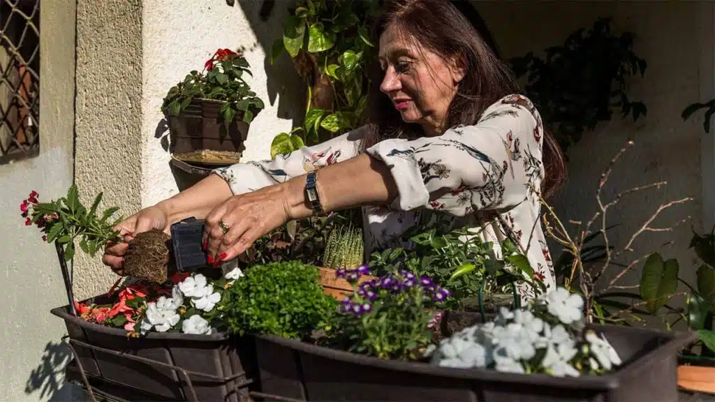 Senior woman gardening on her patio