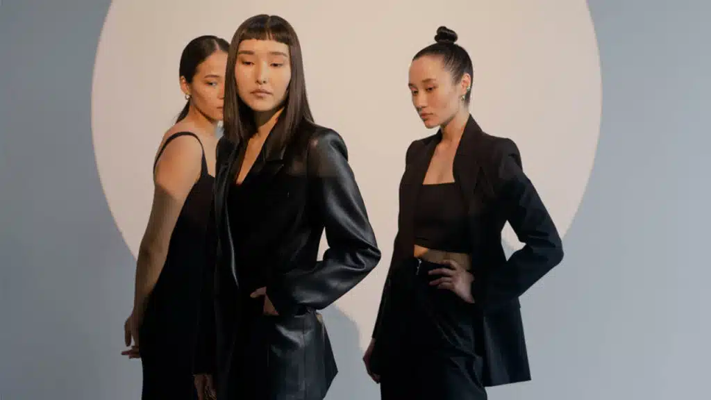 The overall mood is elegant and contemporary, with an emphasis on high fashion and minimalism