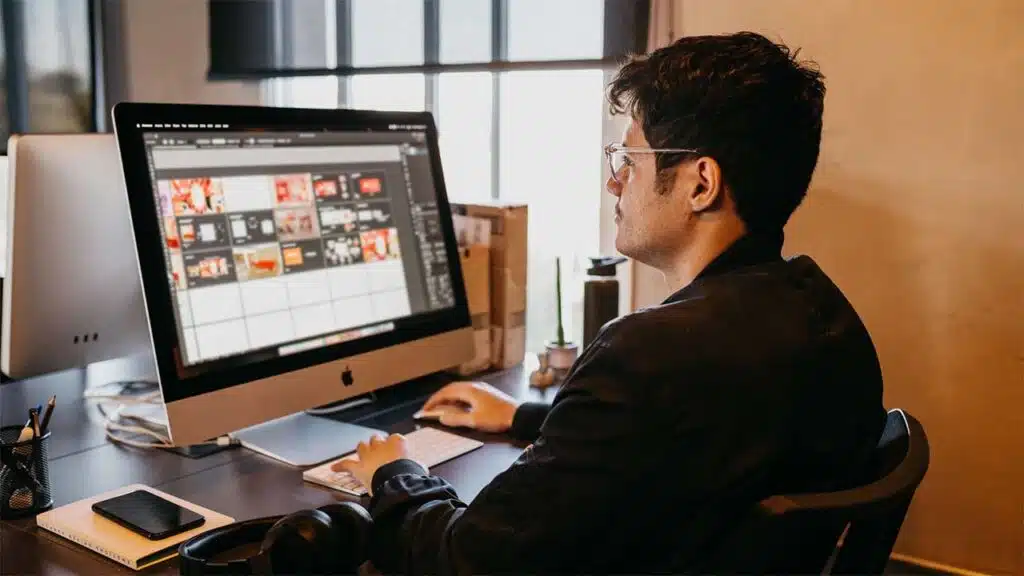 Graphic Designer Working on Computer in Modern Office