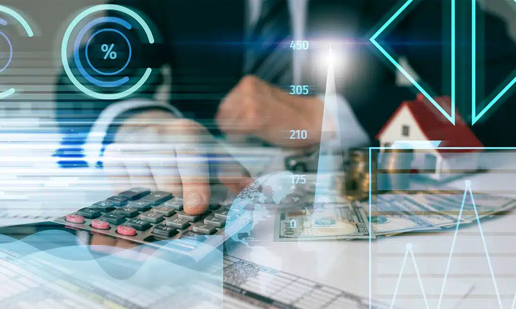 Financial professional using a calculator with digital graphs and data overlays.