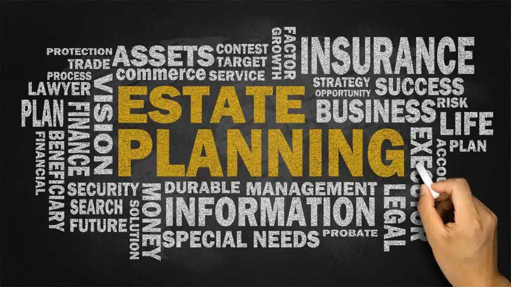 Couple is holding papers while the man in the suit is sharing what looks like a estate plan