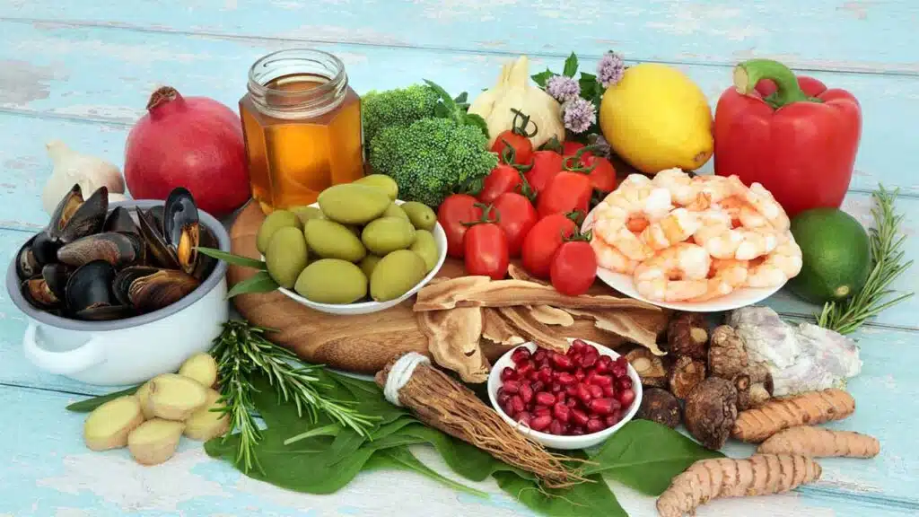 Colorful assortment of healthy foods displayed on a wooden surface