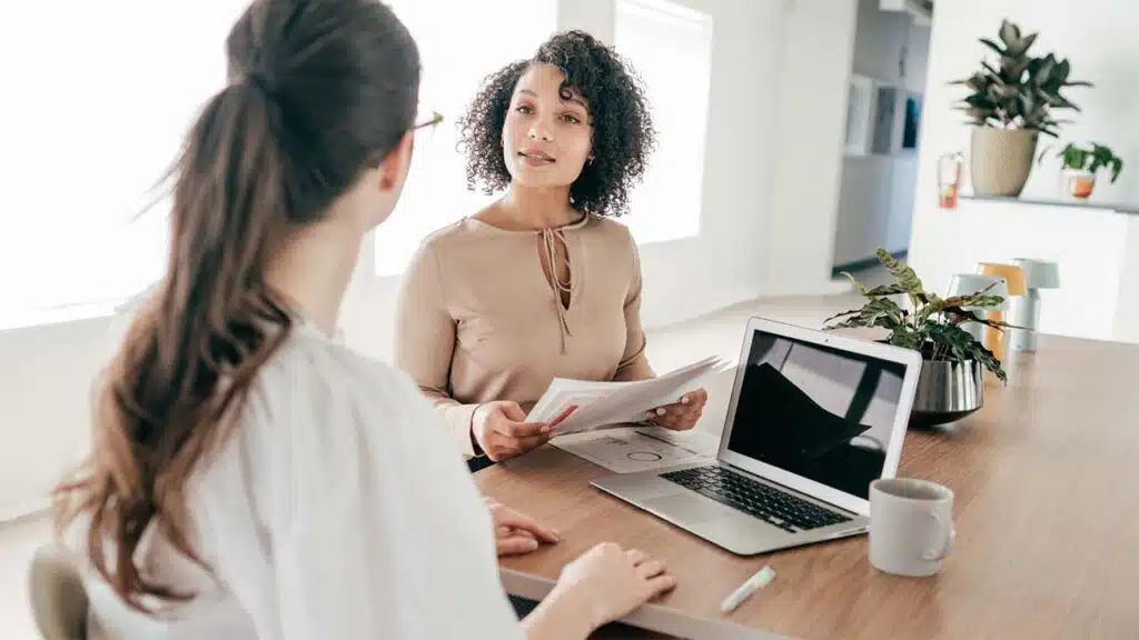 Professional Business Meeting Between Two Women in Office