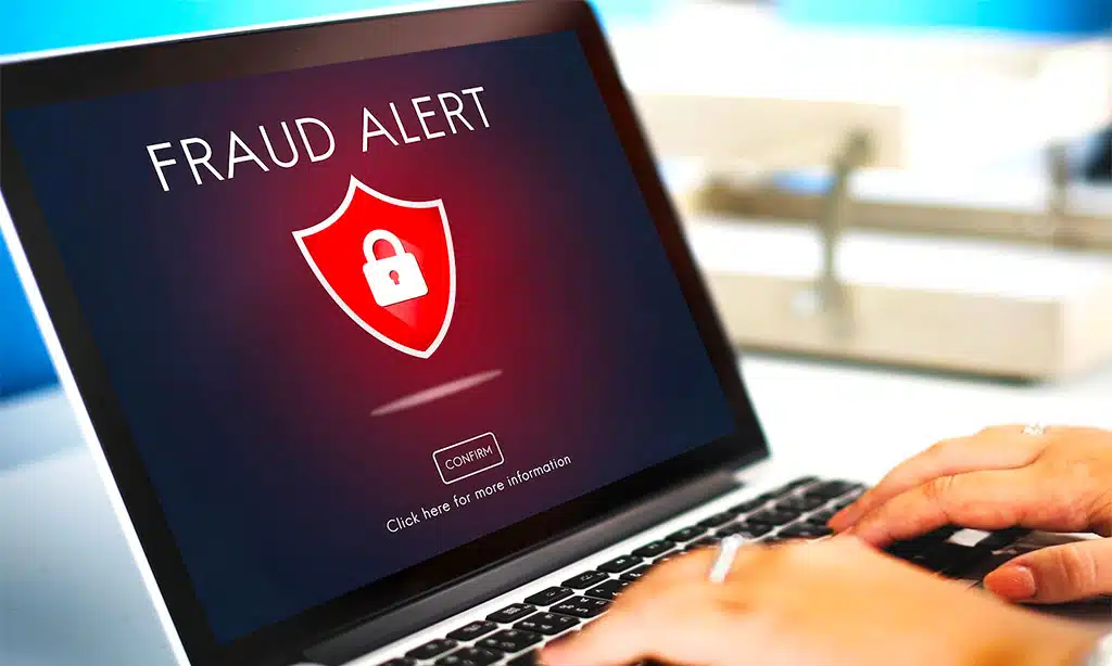 Displaying a "Fraud Alert" message with a red shield and a lock icon, warning of a potential security threat