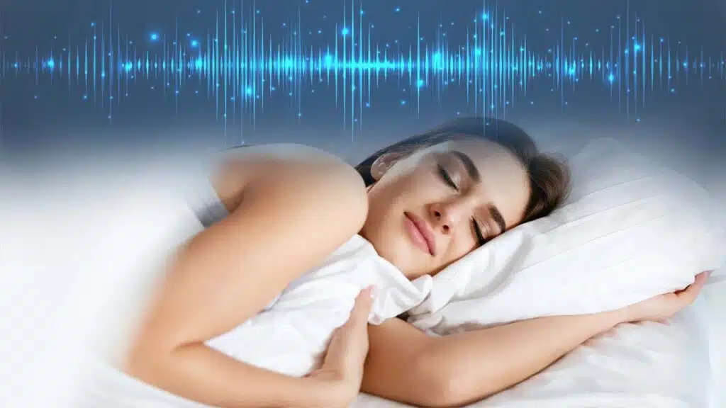 Peaceful woman sleeping soundly on a white pillow with a soft smile