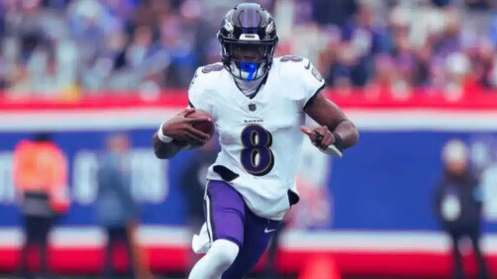 lamar jackson breaks qb rushing record