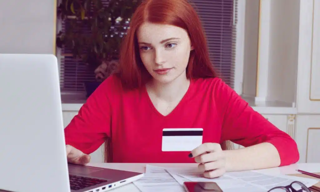 Does the credit card report authorized users to credit bureaus