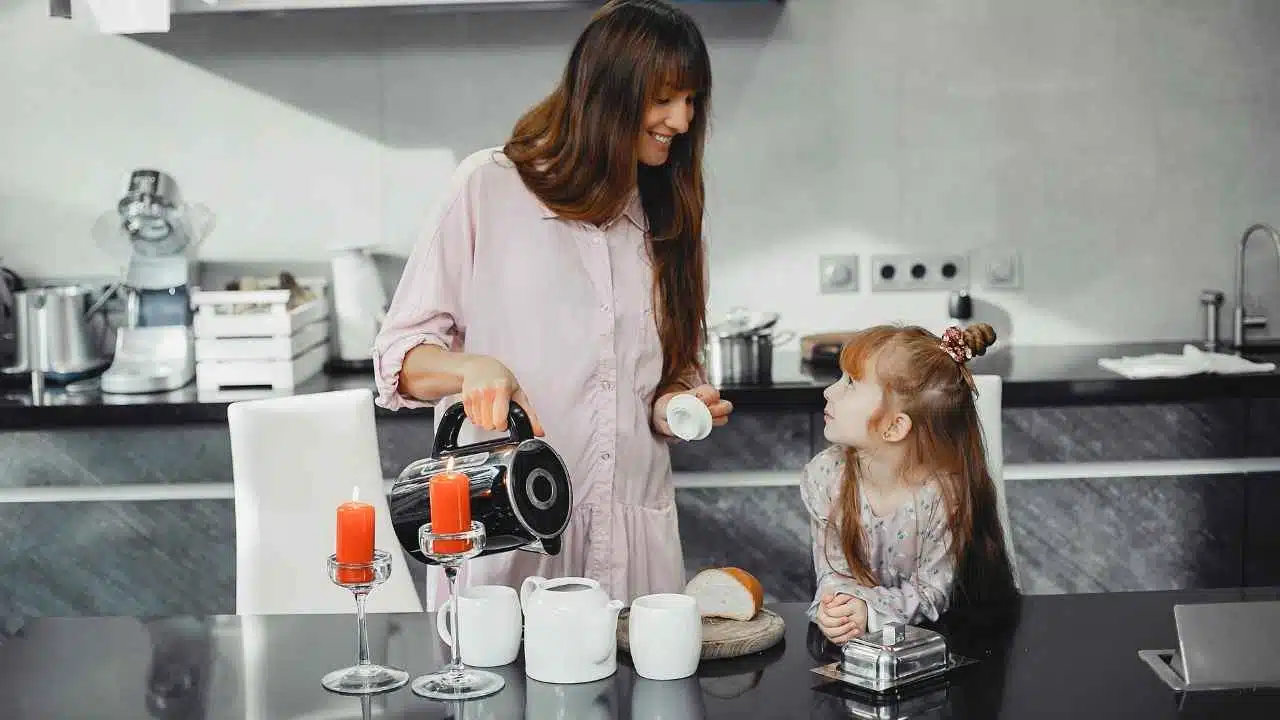 Mother with daughter in a kitchen
